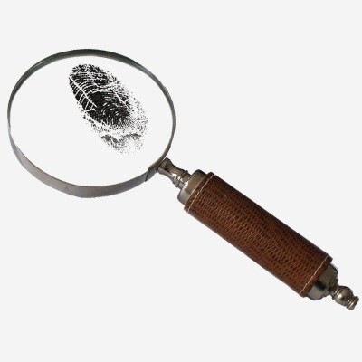 magnifying glass examining fingerprint